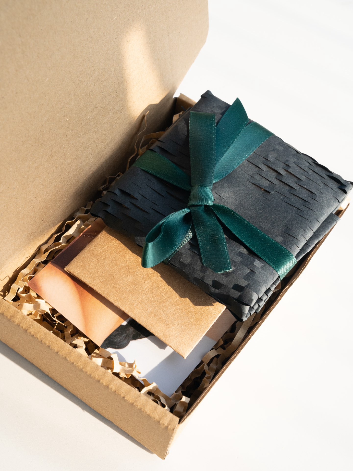 Kraft mailer with green ribbon